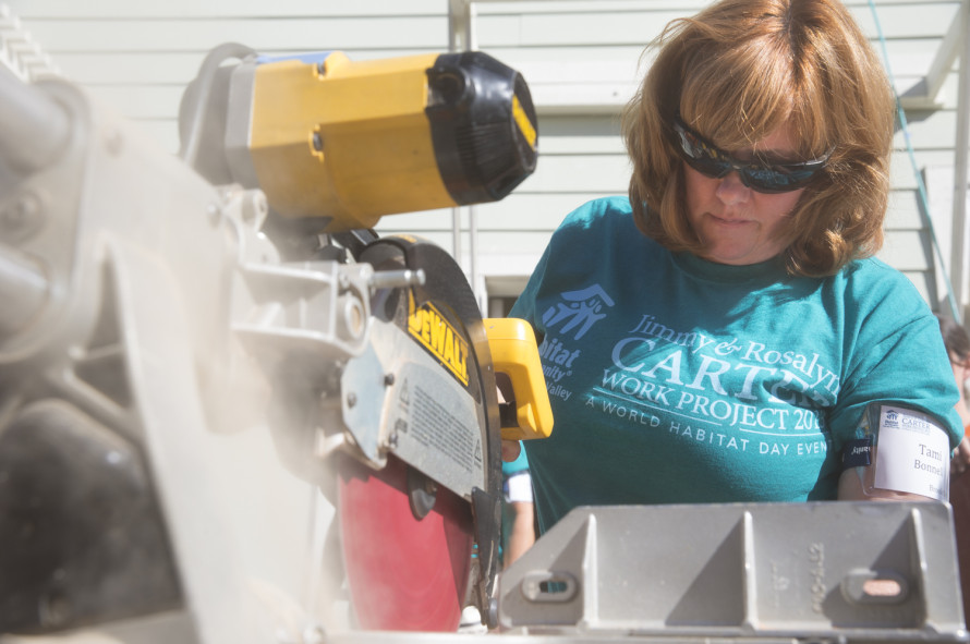 Tami Bonnell, CEO of EXIT Realty Corp. International taking part in Habitat for Humanity work project. 