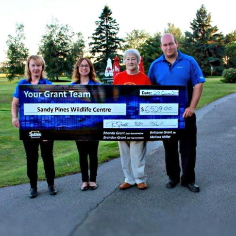 Your Grant Team presents a cheque to Sandy Pines Wildlife Centre.