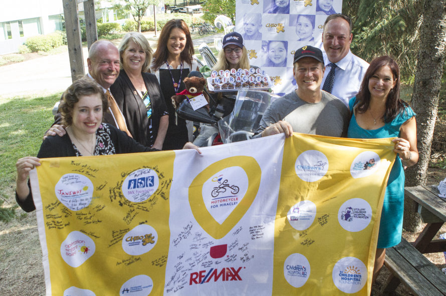 Bruce and Holly Johnson with CHEO representatives. Photo: Matt Day