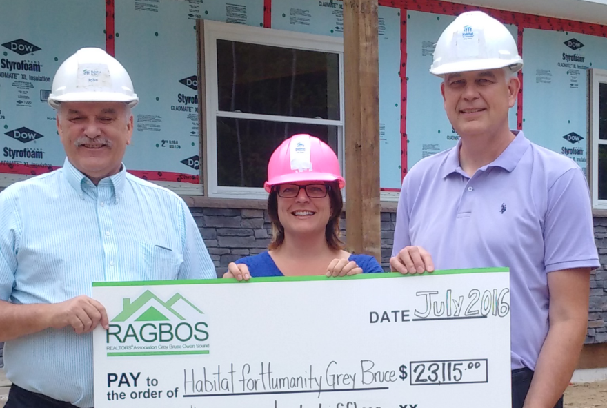 From left: John McLachlan, HFHGB Community Partnerships Co-ordinator; Dawn Lee McKenzie, RAGBOS President; Gregg Fryer, HFHGB Executive Director