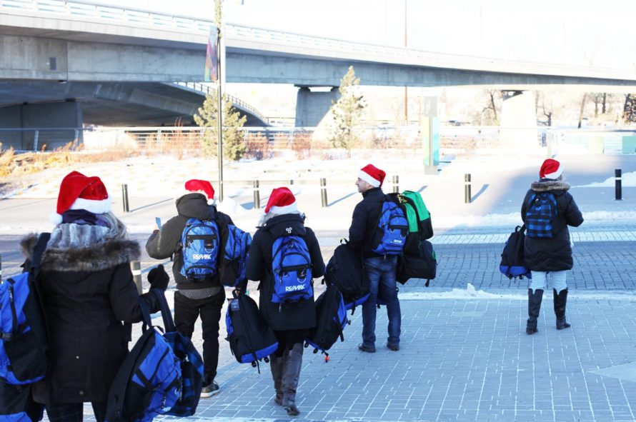 REALTORS® at RE/MAX iREALTY Innovations gave backpacks to the homeless. (Facebook photo)